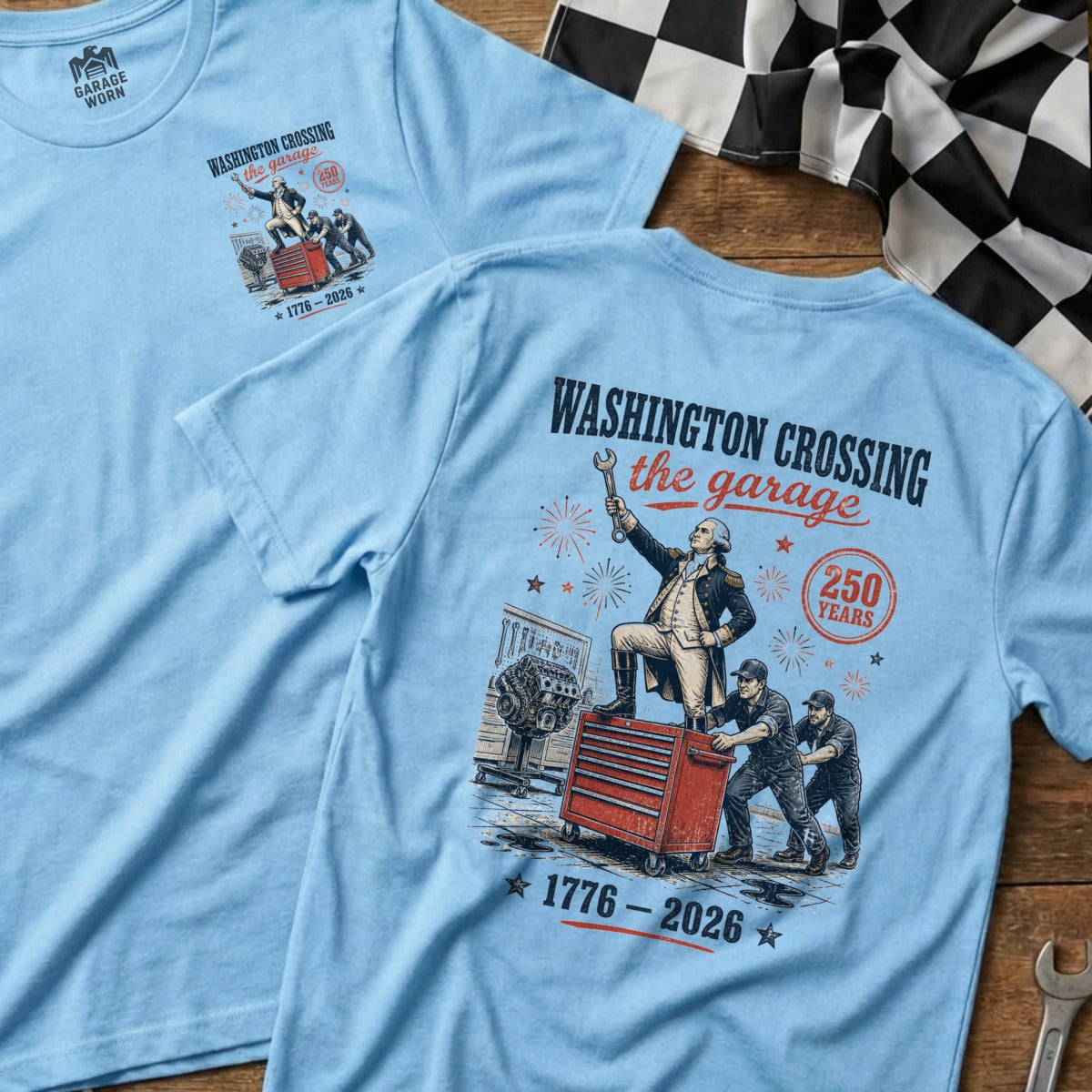 Light blue t-shirt with "Washington Crossing the Garage" text and graphic.