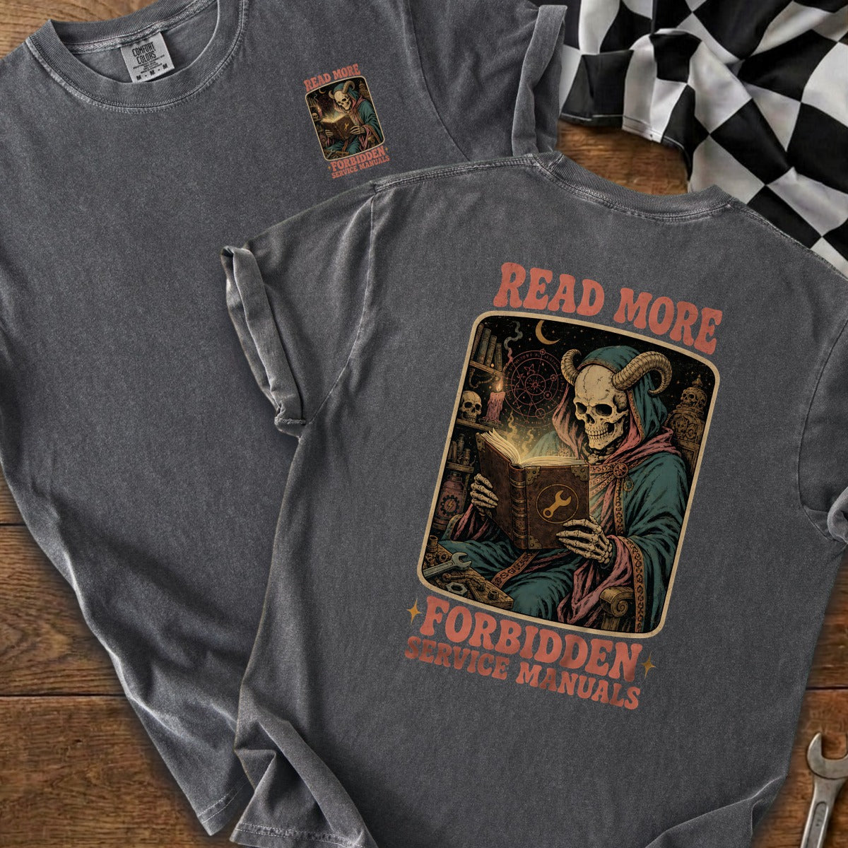 Skeleton in robes reads book with wrench symbol, text "READ MORE FORBIDDEN SERVICE MANUALS".