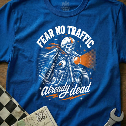 Blue t-shirt graphic of skeleton riding motorcycle with text "FEAR NO TRAFFIC already dead".