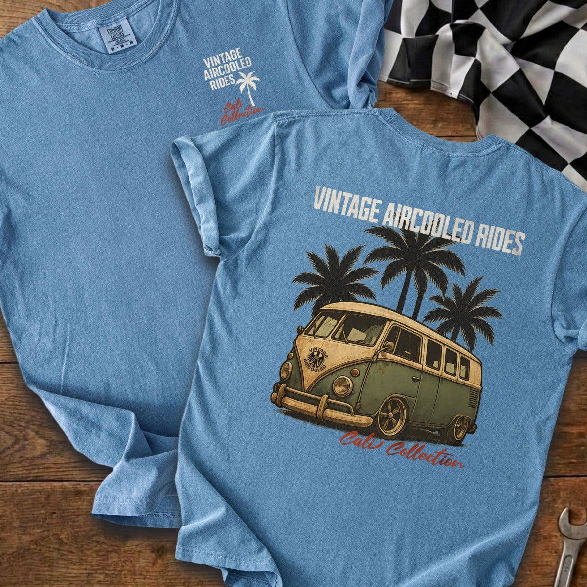 Blue t-shirt with vintage aircooled rides text, palm trees, and van graphic.