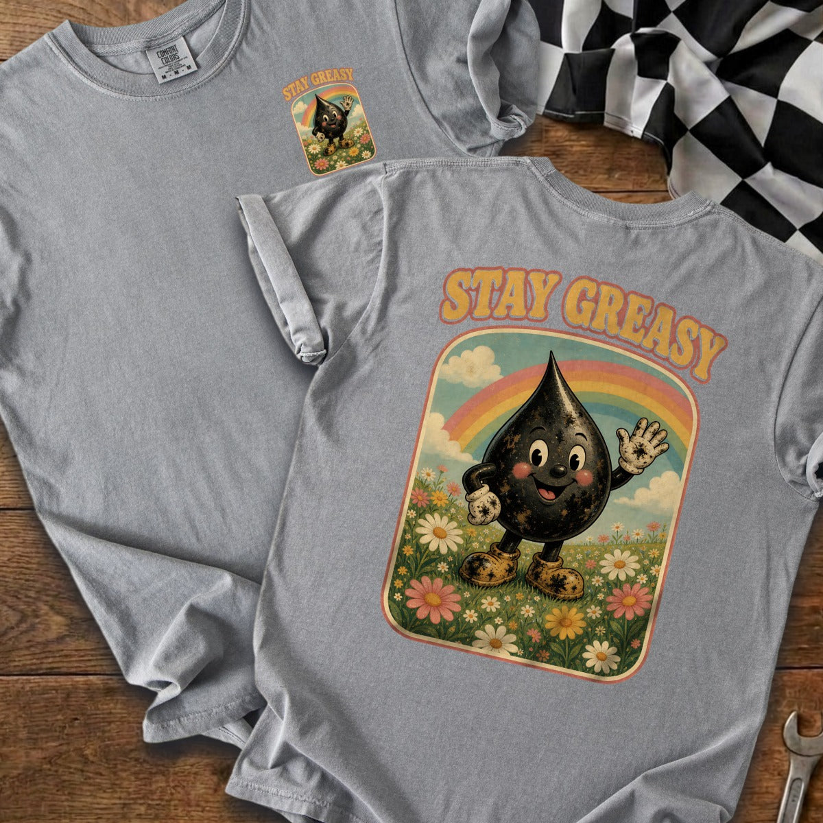 Gray t-shirt with "STAY GREASY" text and cartoon oil drop in a field.
