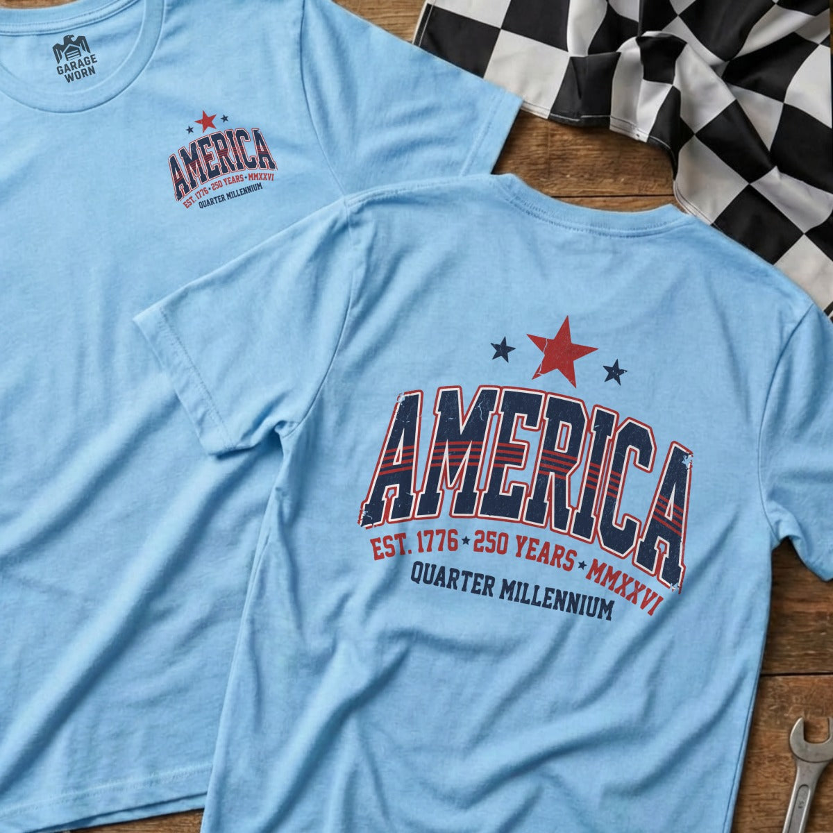 Light blue t-shirt with "America" graphic, EST. 1776 250 YEARS MMXXVI.