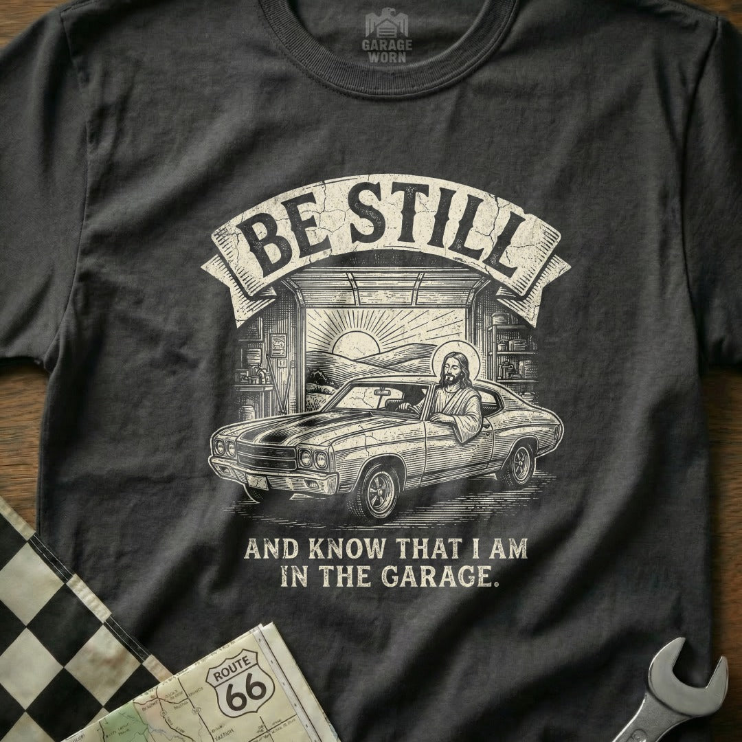 T-shirt with Jesus in a muscle car and "Be Still and Know That I Am In The Garage."
