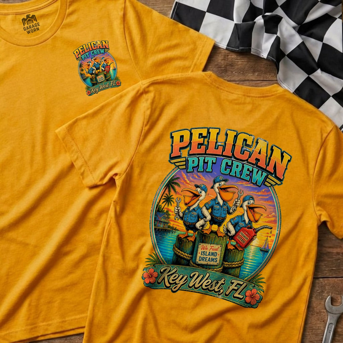 Yellow t-shirt with "Pelican Pit Crew" graphic of three pelicans and "Key West, FL".