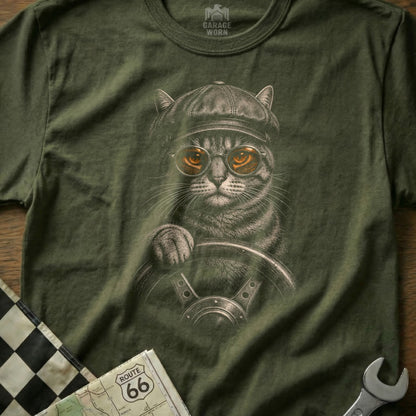 T-shirt graphic of a cat wearing a cap and goggles, holding a steering wheel.