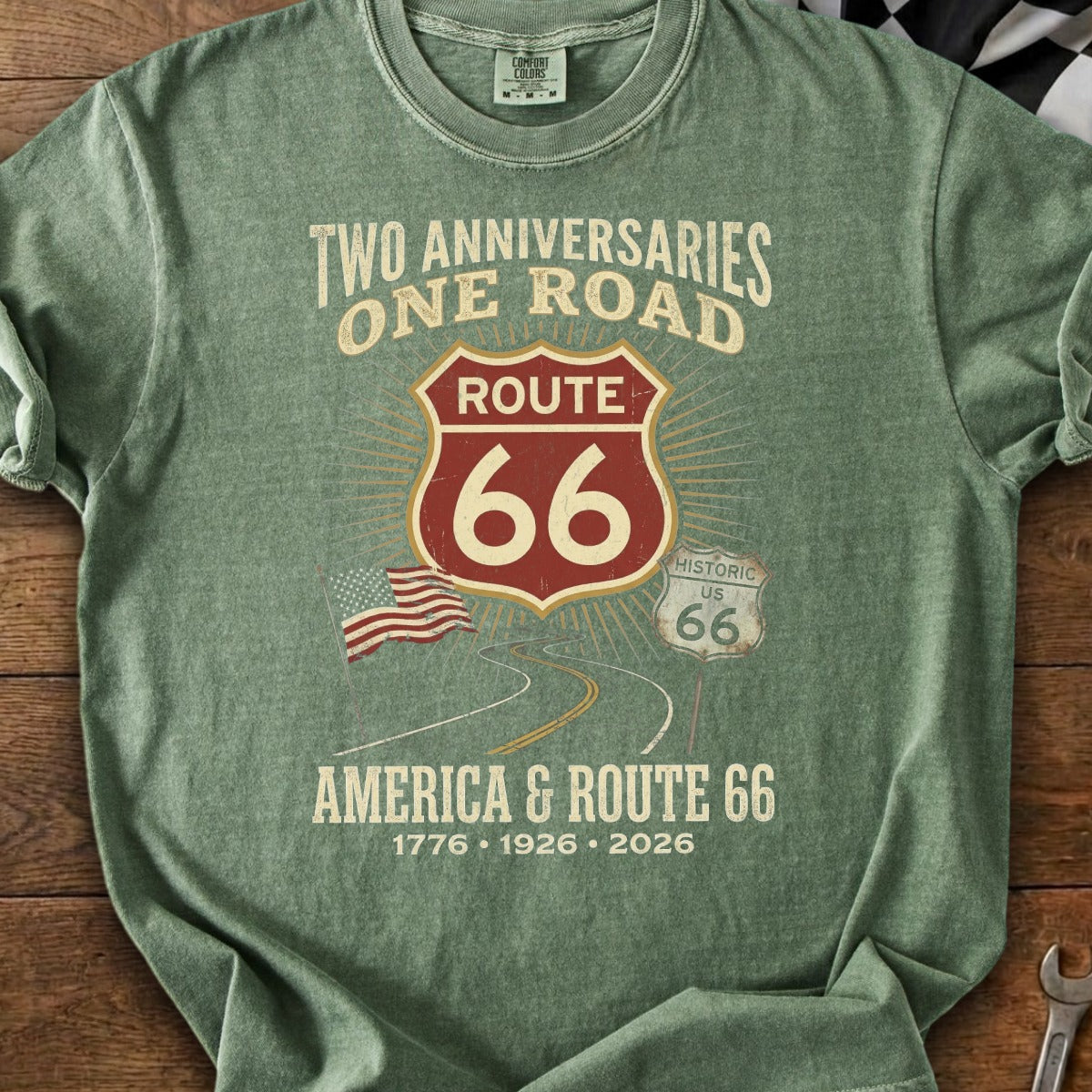 Green t-shirt with Route 66 graphic, American flag, and text "Two Anniversaries, One Road".
