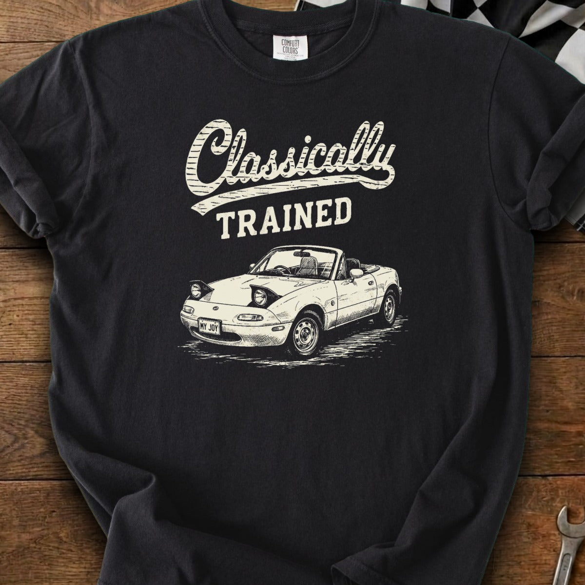 Black t-shirt with "Classically TRAINED" and drawing of a white convertible Miata.