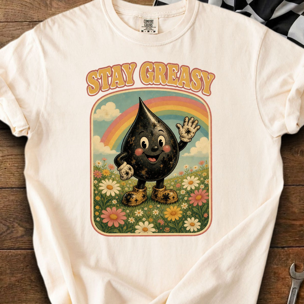 Shirt with vintage graphic of a smiling oil drop character and "STAY GREASY" text.