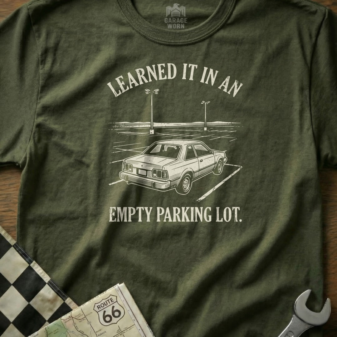T-shirt with "Learned it in an empty parking lot" text and car graphic.