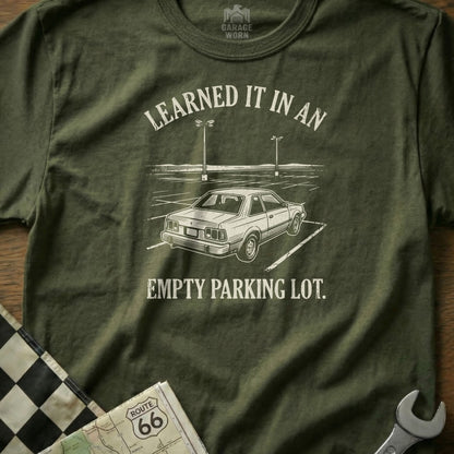 T-shirt with "Learned it in an empty parking lot" text and car graphic.