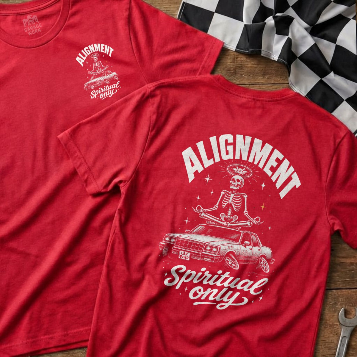 Red t-shirt with skeleton meditating on car, "Alignment Spiritual Only" text