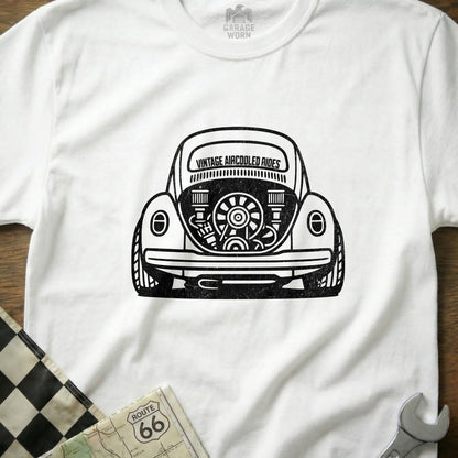 White t-shirt with vintage air-cooled Volkswagen Beetle rear engine graphic.