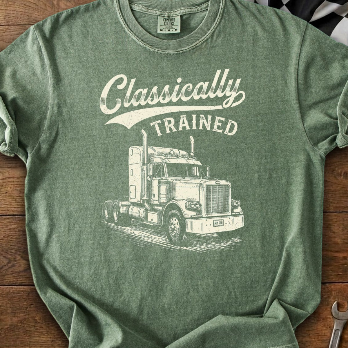 Green t-shirt with "Classically TRAINED" text and a detailed drawing of a semi-truck.