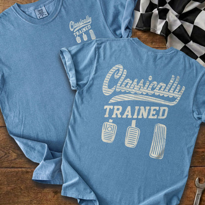 Light blue t-shirt with "Classically TRAINED" and three pedal graphics.