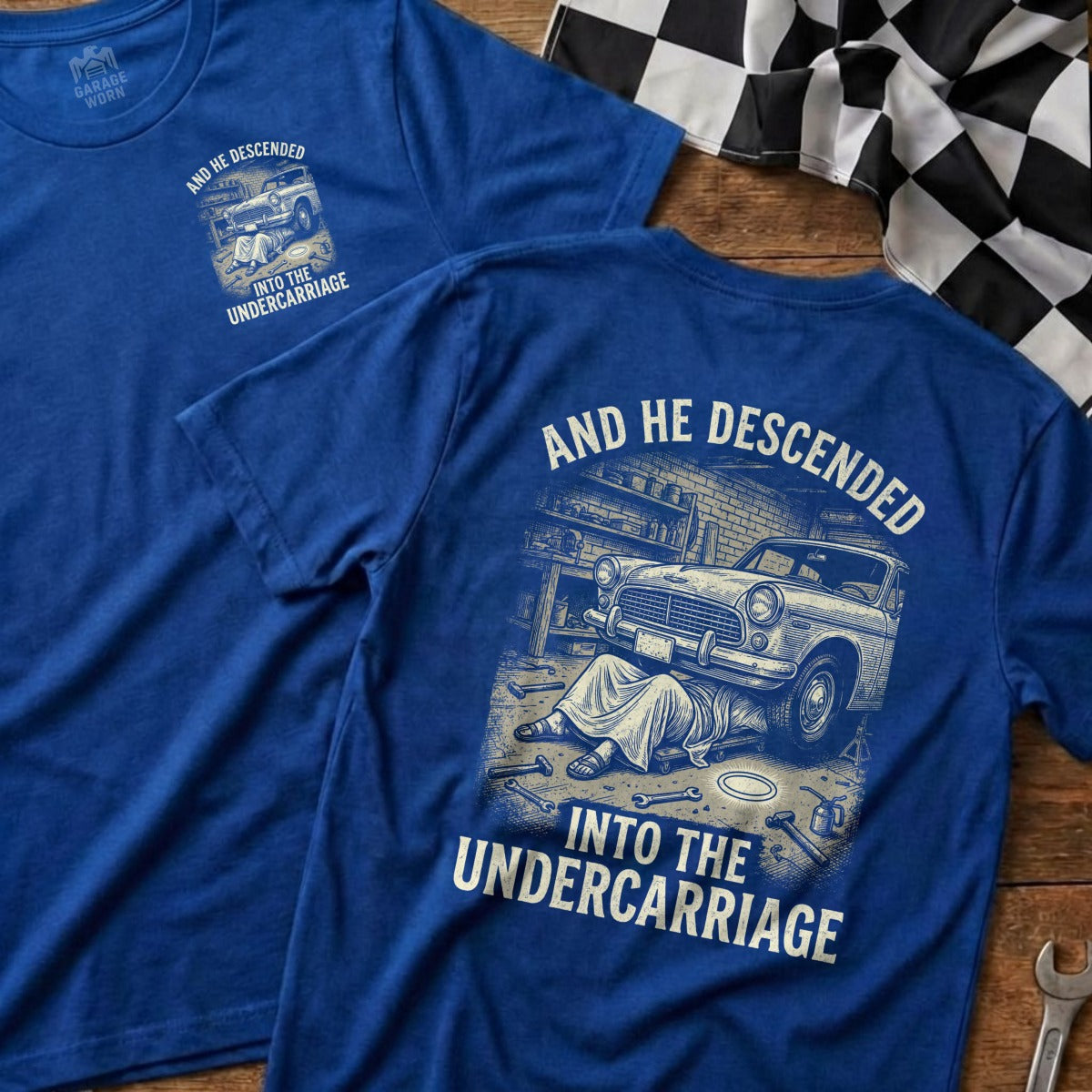 Blue t-shirt with "And He Descended Into The Undercarriage" graphic.