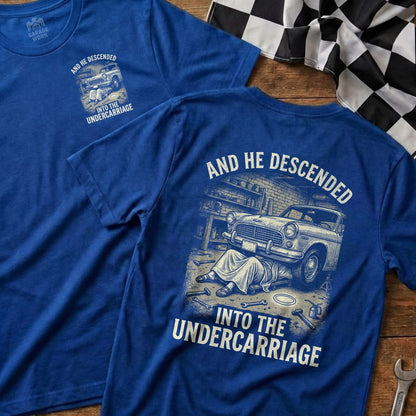 Blue t-shirt with "And He Descended Into The Undercarriage" graphic.