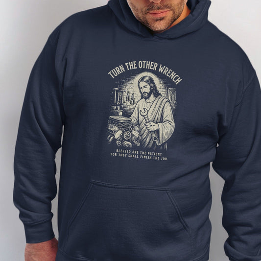 Jesus holding a wrench next to an engine, with text "TURN THE OTHER WRENCH".