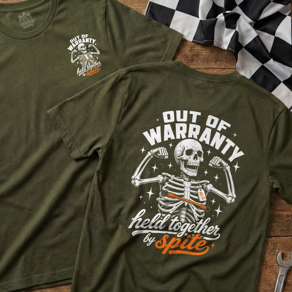 Green t-shirt with skeleton graphic and text "Out of Warranty Held Together By Spite".