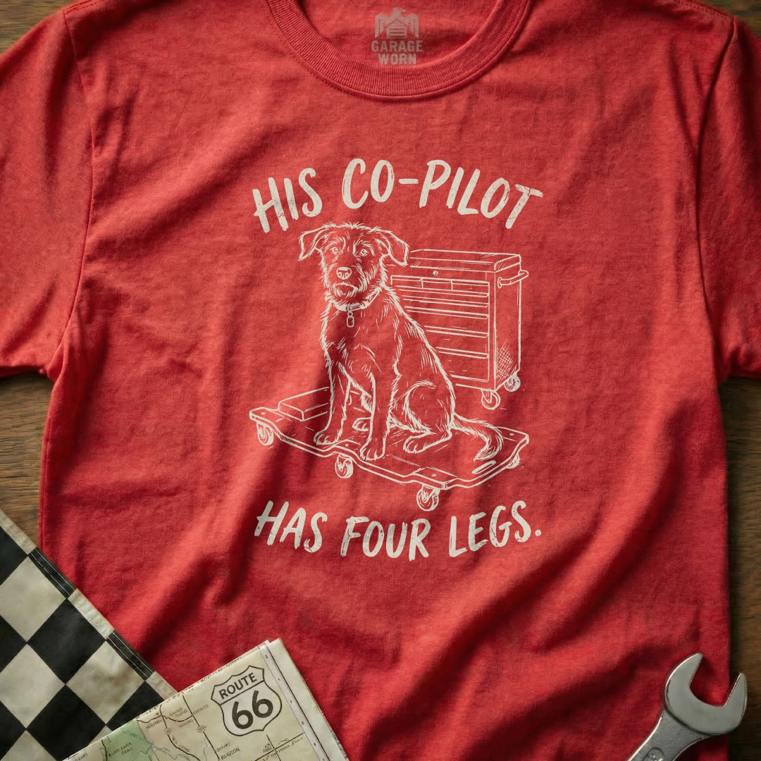 T-shirt with "HIS CO-PILOT HAS FOUR LEGS" text and dog on tool cart graphic.