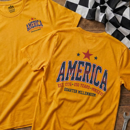 Yellow t-shirts with "AMERICA EST. 1776 250 YEARS MMXXVI QUARTER MILLENNIUM" text.