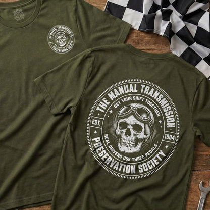 Olive green t-shirt with "The Manual Transmission Preservation Society" graphic.