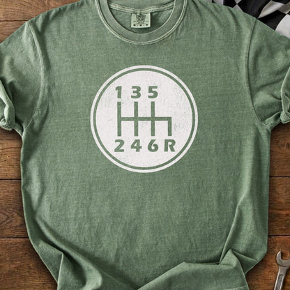 Green t-shirt with a white graphic of a 6-speed manual transmission shift pattern.