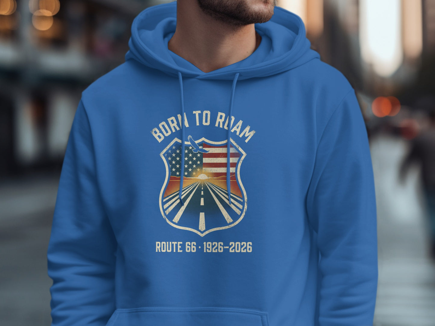 Blue hoodie with "Born to Roam Route 66" shield logo featuring an American flag and sunset.