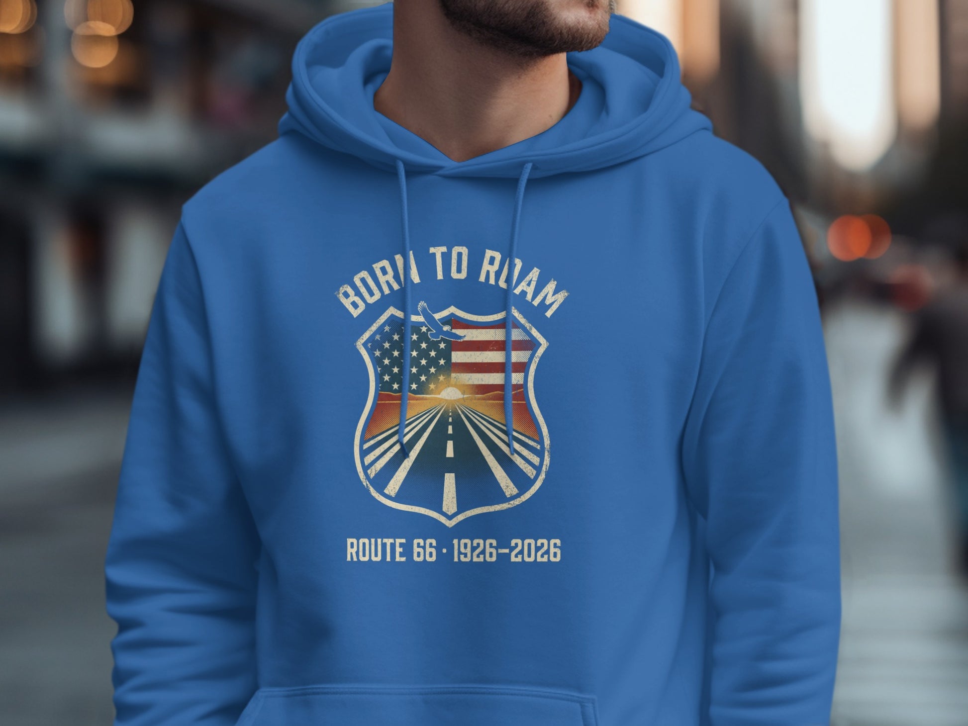 Blue hoodie with "Born to Roam Route 66" shield logo featuring an American flag and sunset.