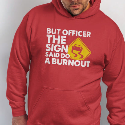 Red hoodie with text "BUT OFFICER THE SIGN SAID DO A BURNOUT" and a car sliding on yellow warning sign.