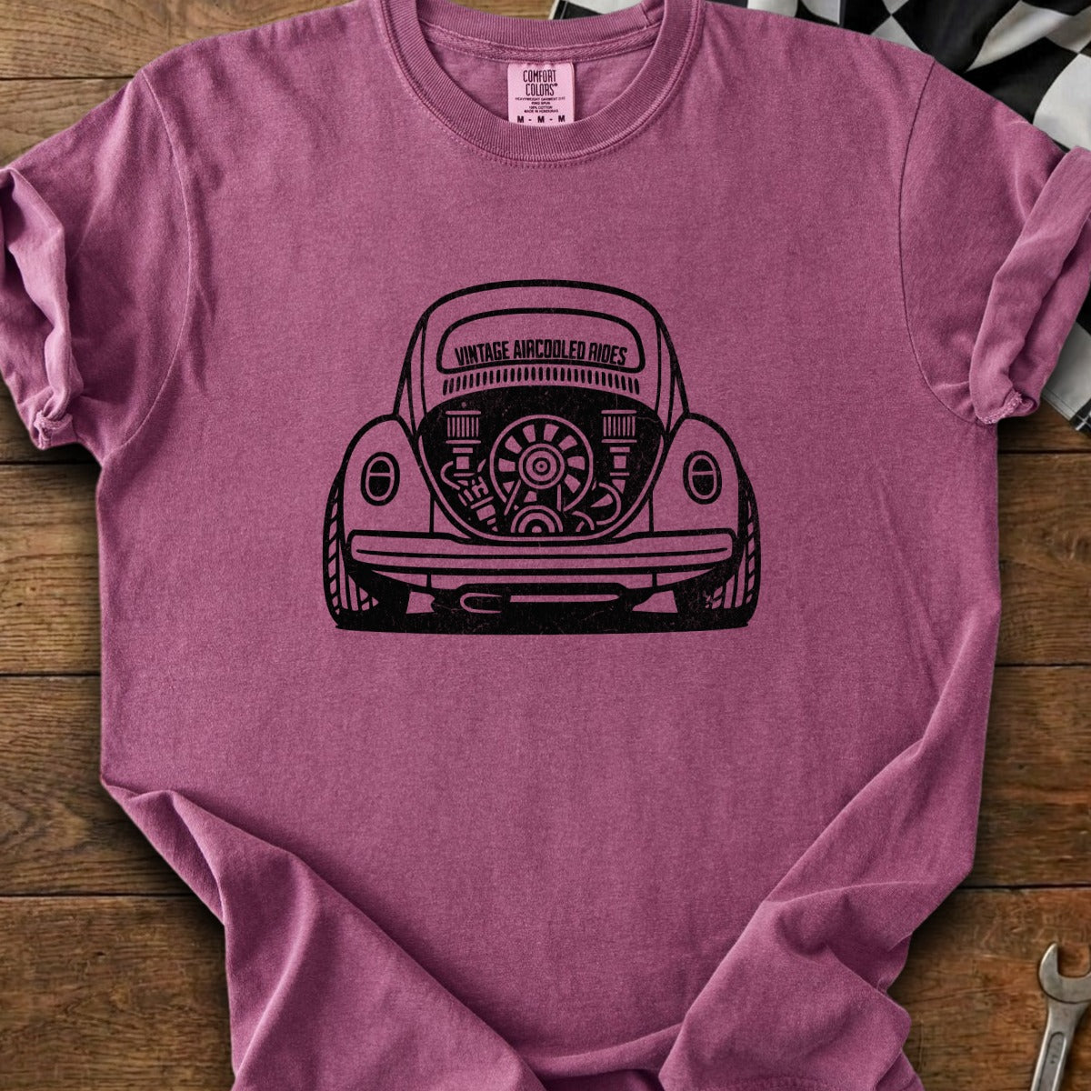 Burgundy t-shirt with black graphic of a vintage Volkswagen Beetle engine and "Vintage Aircoolled Rides" text.