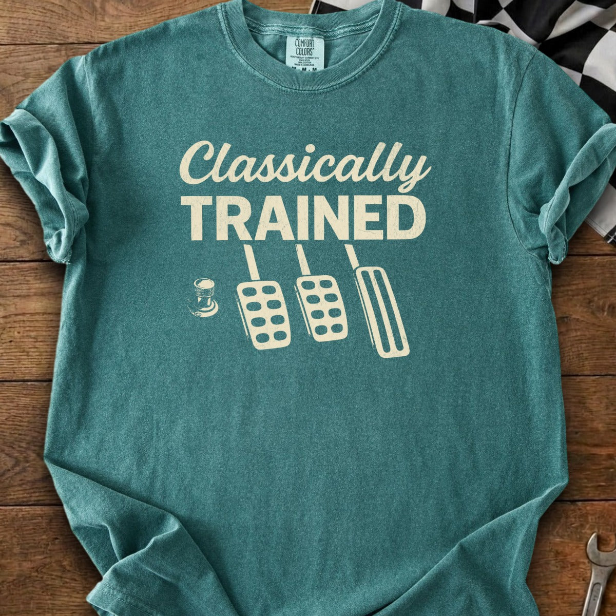 T-shirt with "Classically TRAINED" text and three pedal graphic.