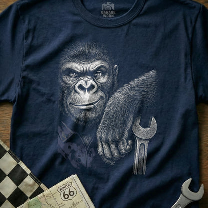 Gorilla wearing a mechanic's shirt holding a wrench, with Route 66 map.