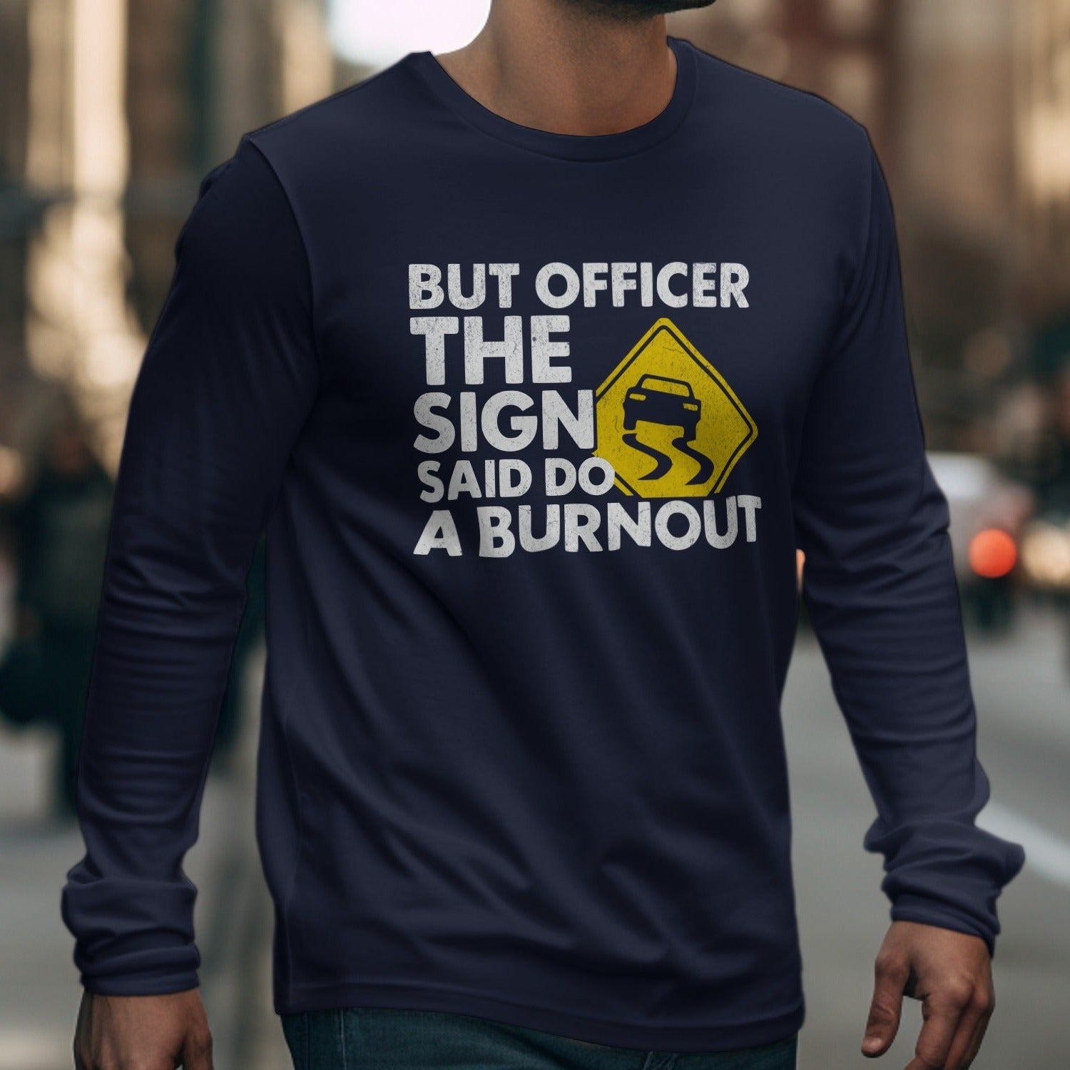 Navy long-sleeve shirt with text and a slippery road sign graphic.