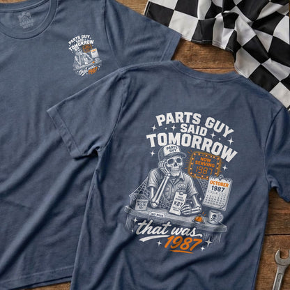 Skeleton wearing a "Parts Guy" hat and shirt, "Parts Guy Said Tomorrow", serving 1987.