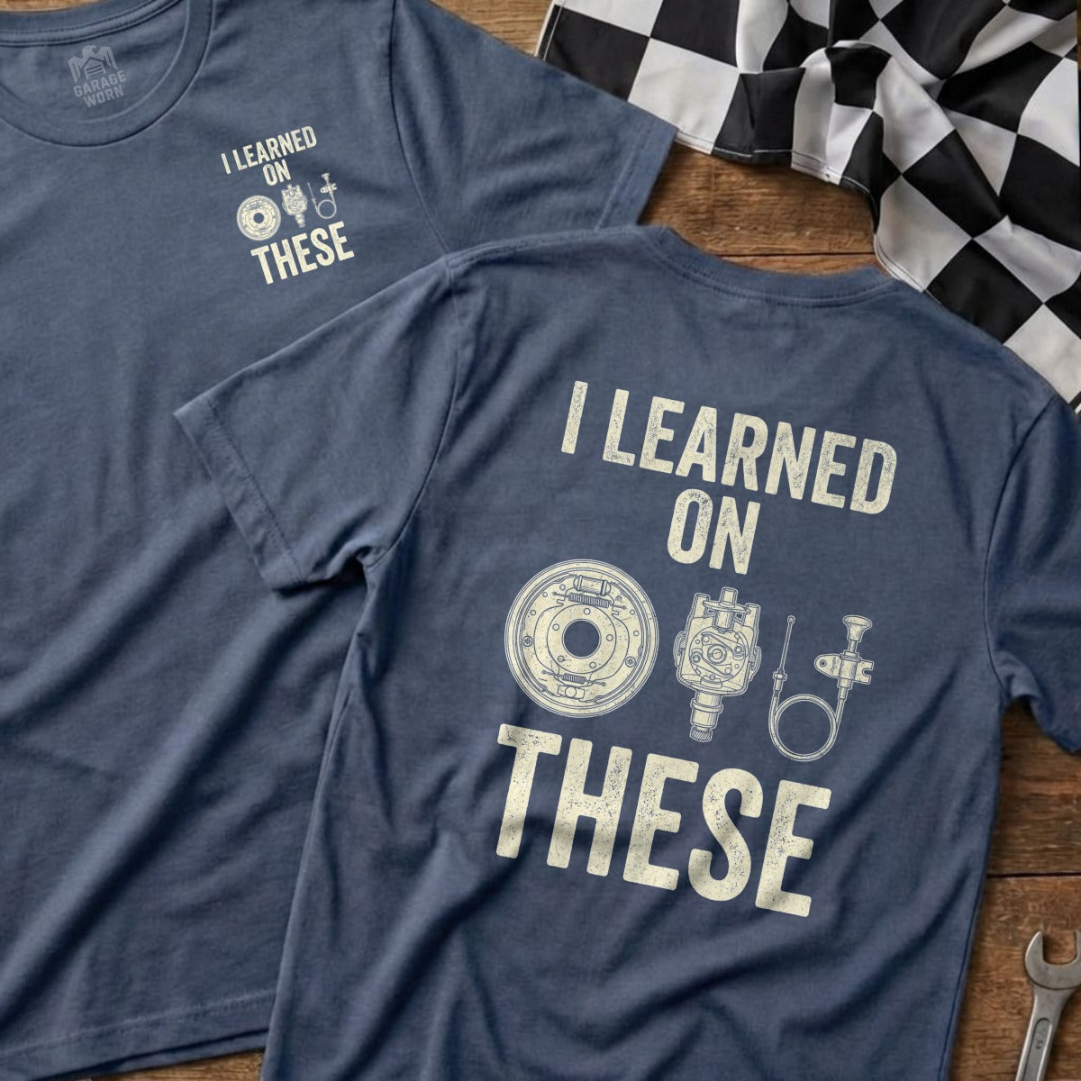 Navy t-shirt with "I LEARNED ON THESE" and car parts graphic.