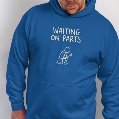 Blue hoodie with cream text "WAITING ON PARTS" and stick figure.