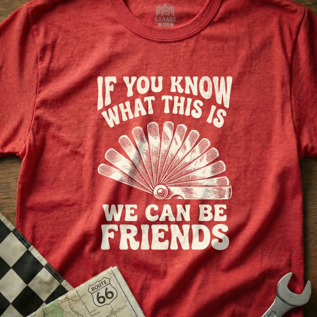Red t-shirt with "If You Know What This Is, We Can Be Friends" and a feeler gauge.