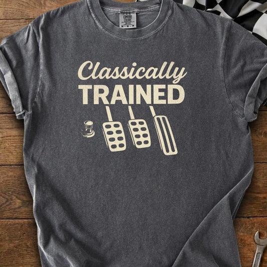 T-shirt with "Classically TRAINED" text and clutch, brake, and gas pedal graphic.