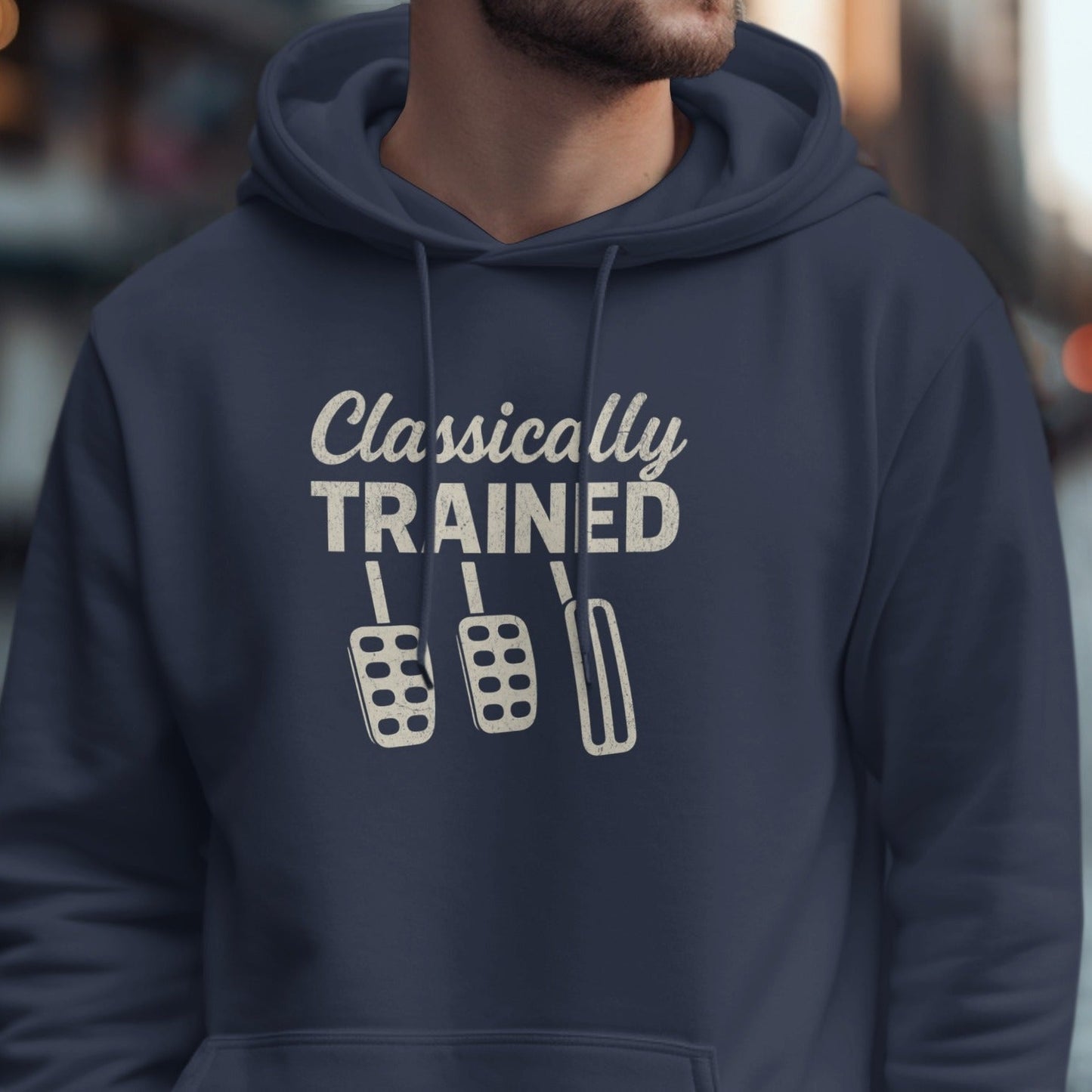 Navy hoodie with "Classically TRAINED" and three manual car pedals design.