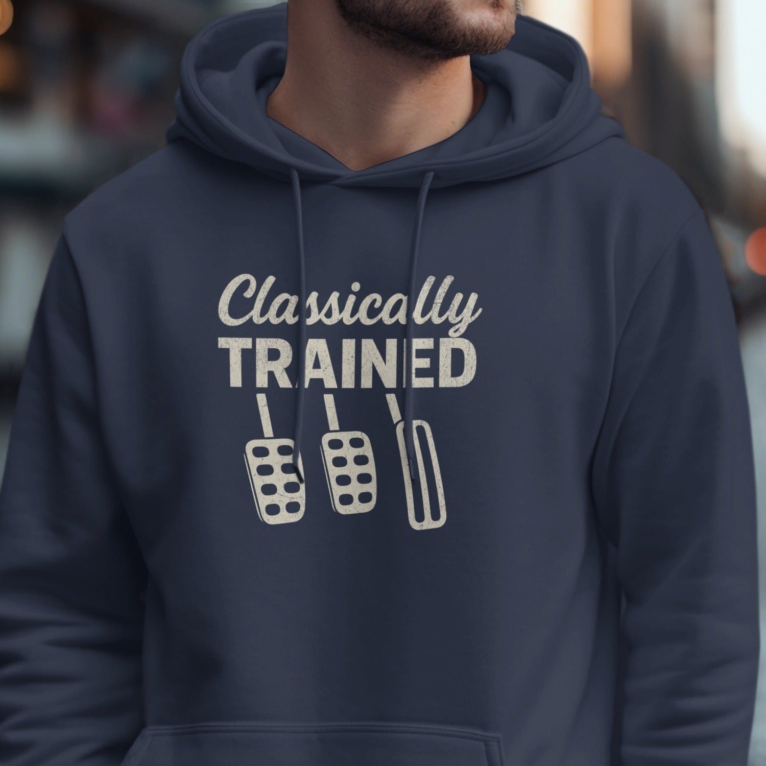 Navy hoodie with "Classically TRAINED" and three manual car pedals design.