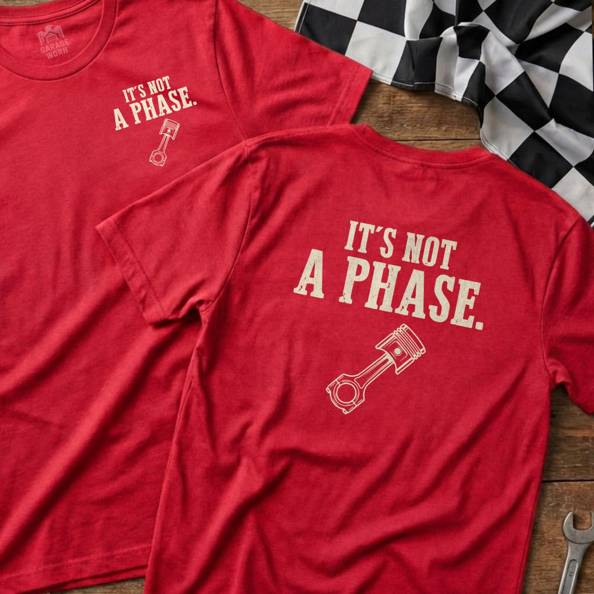 Red t-shirts with "It's Not A Phase" and a piston graphic.