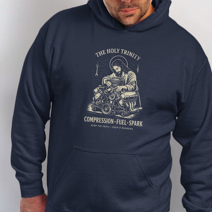 Jesus working on an engine with text "The Holy Trinity Compression Fuel Spark".