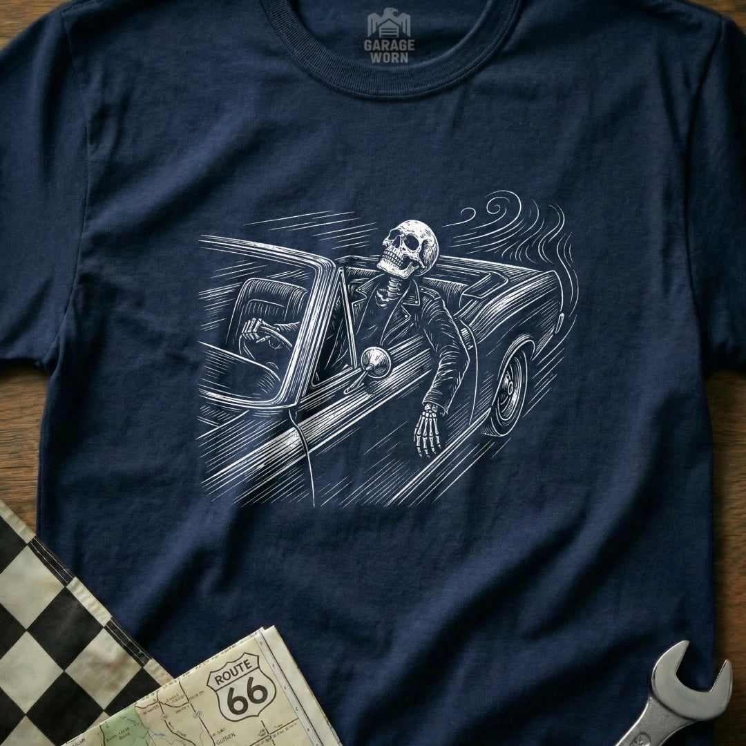 Skeleton driving a classic car on Route 66, with checkered flag.