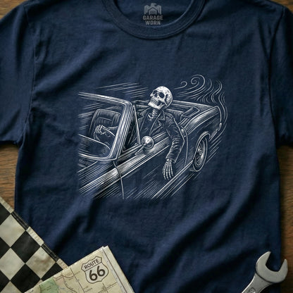 Skeleton driving a classic car on Route 66, with checkered flag.