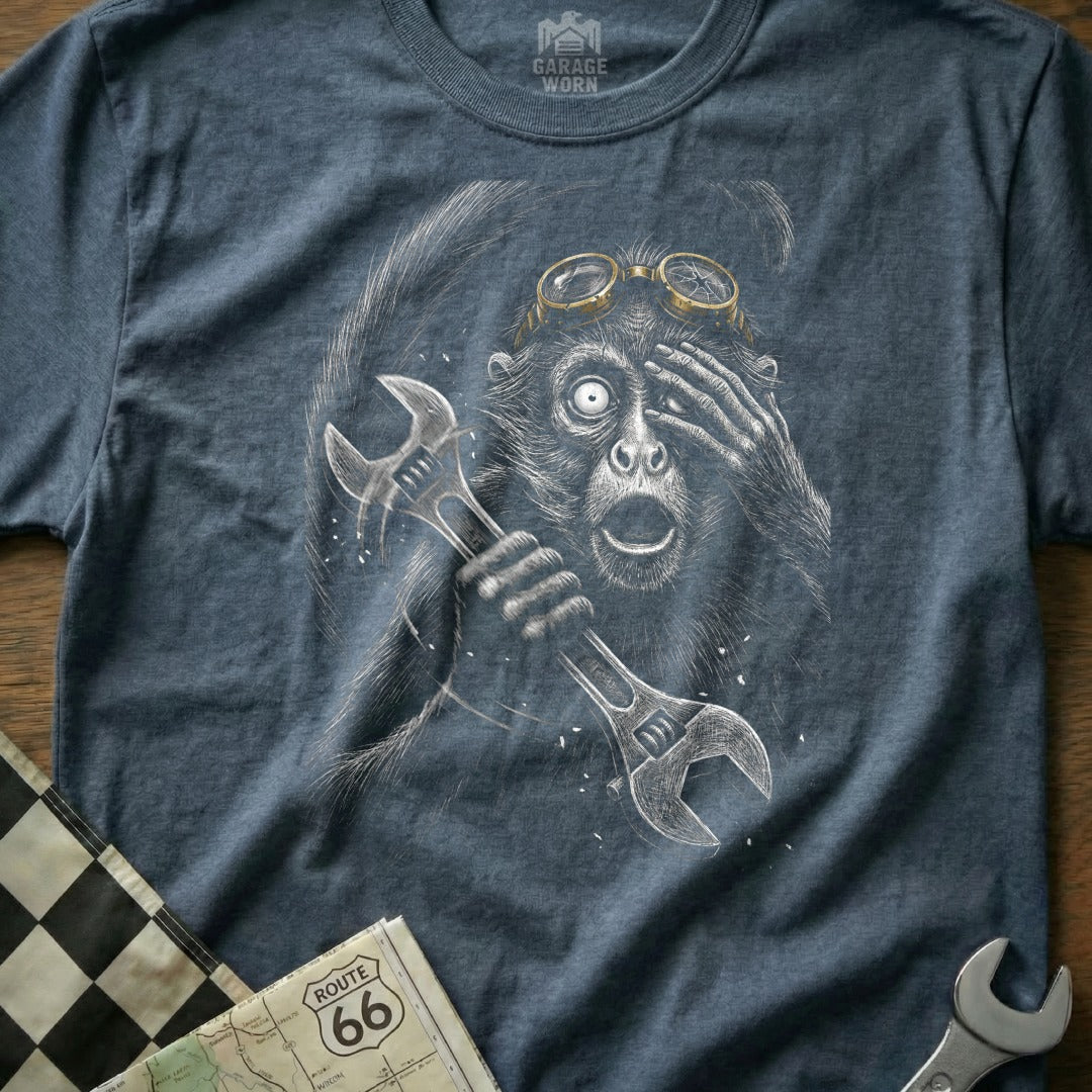 Monkey wearing goggles and holding wrenches, with Route 66 map.
