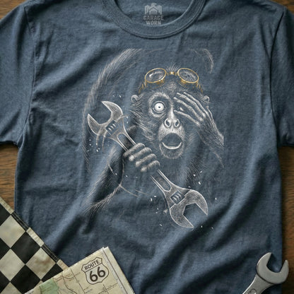 Monkey wearing goggles and holding wrenches, with Route 66 map.