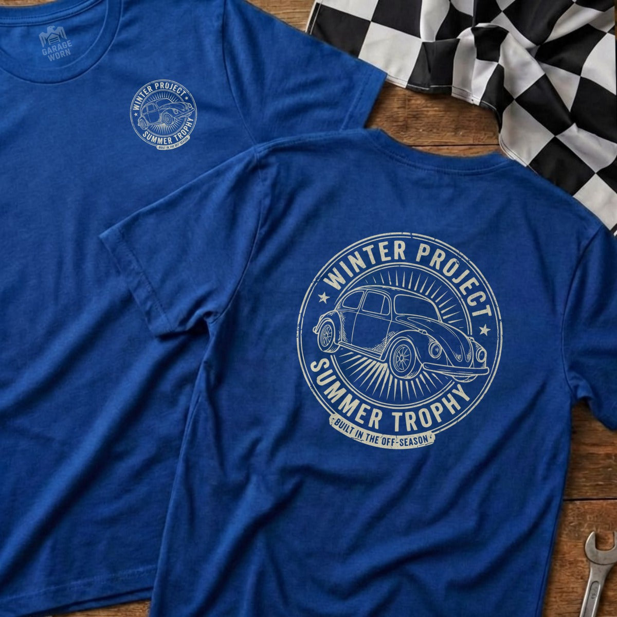 Two blue t-shirts featuring a vintage car and "Winter Project Summer Trophy" text.