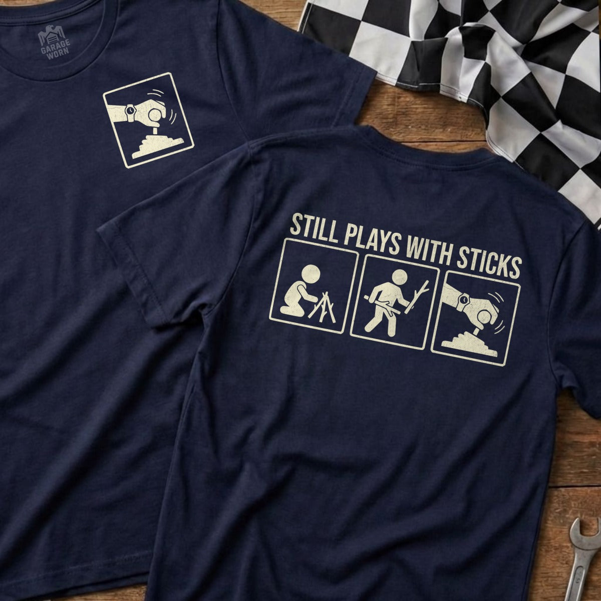 Navy t-shirts with "STILL PLAYS WITH STICKS" text and gear shifter icons.