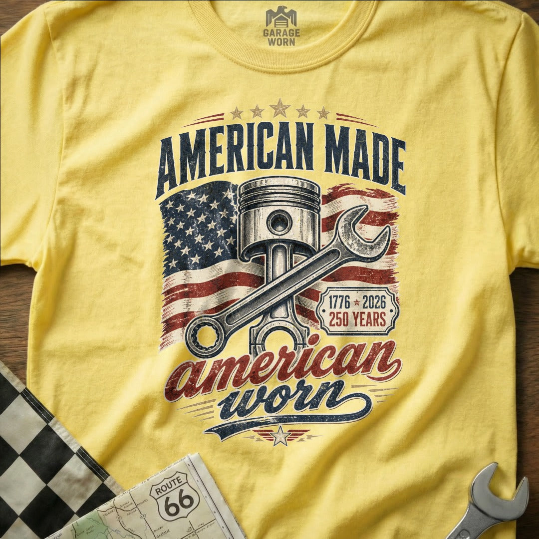 Yellow t-shirt with "American Made, American Worn" piston and flag graphic.