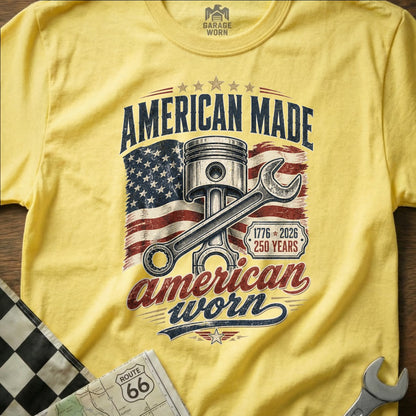 Yellow t-shirt with "American Made, American Worn" piston and flag graphic.